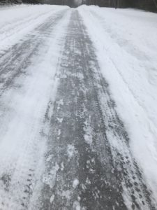 Bare tire tracks on snowy road