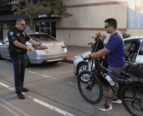 sergeant shows cyclist to never ride in door zone
