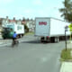 Cyclist safely passing large truck