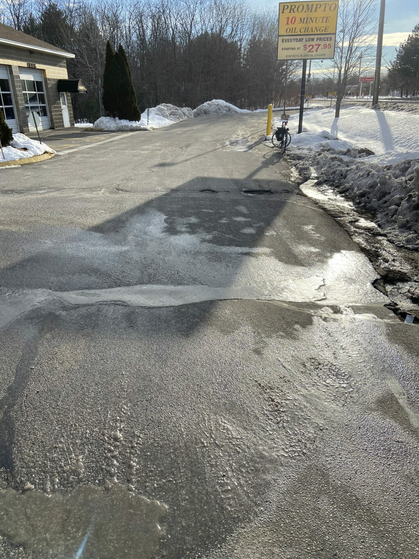 Ice covering entire right-hand lane of two-lane street