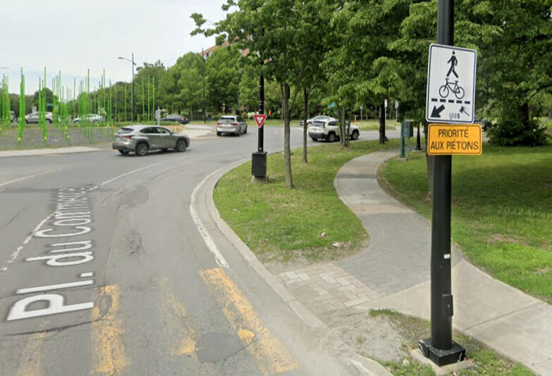 Signs indicating yielding rules at the Place du Commerce on nuns' Island in Montreal.